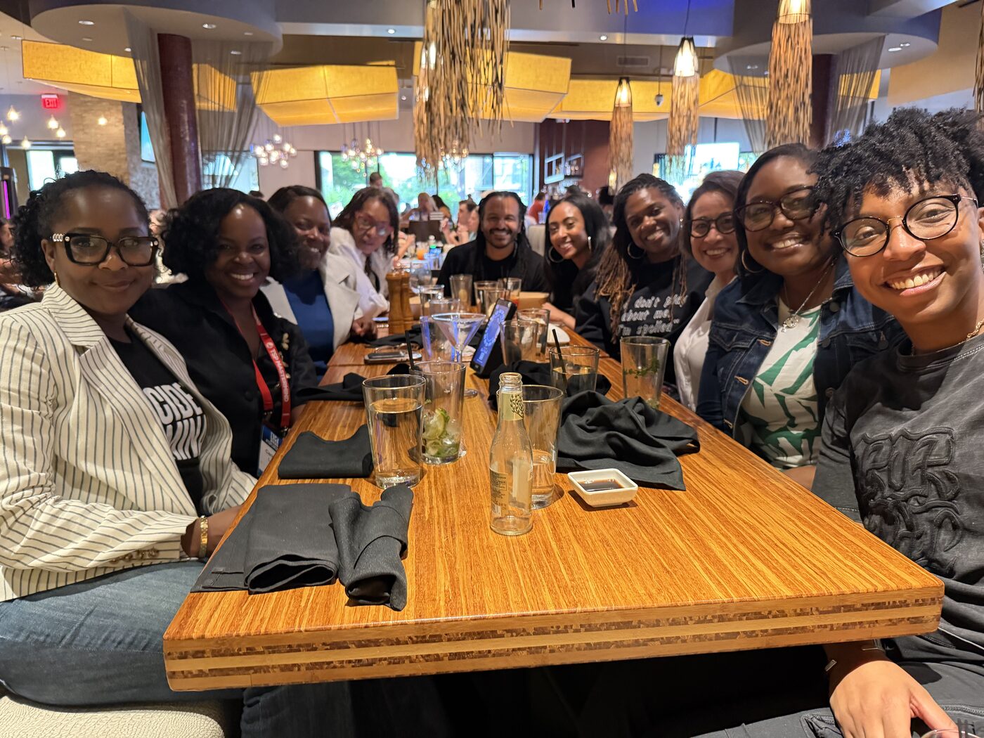 Arena members gathered around a long dinner table