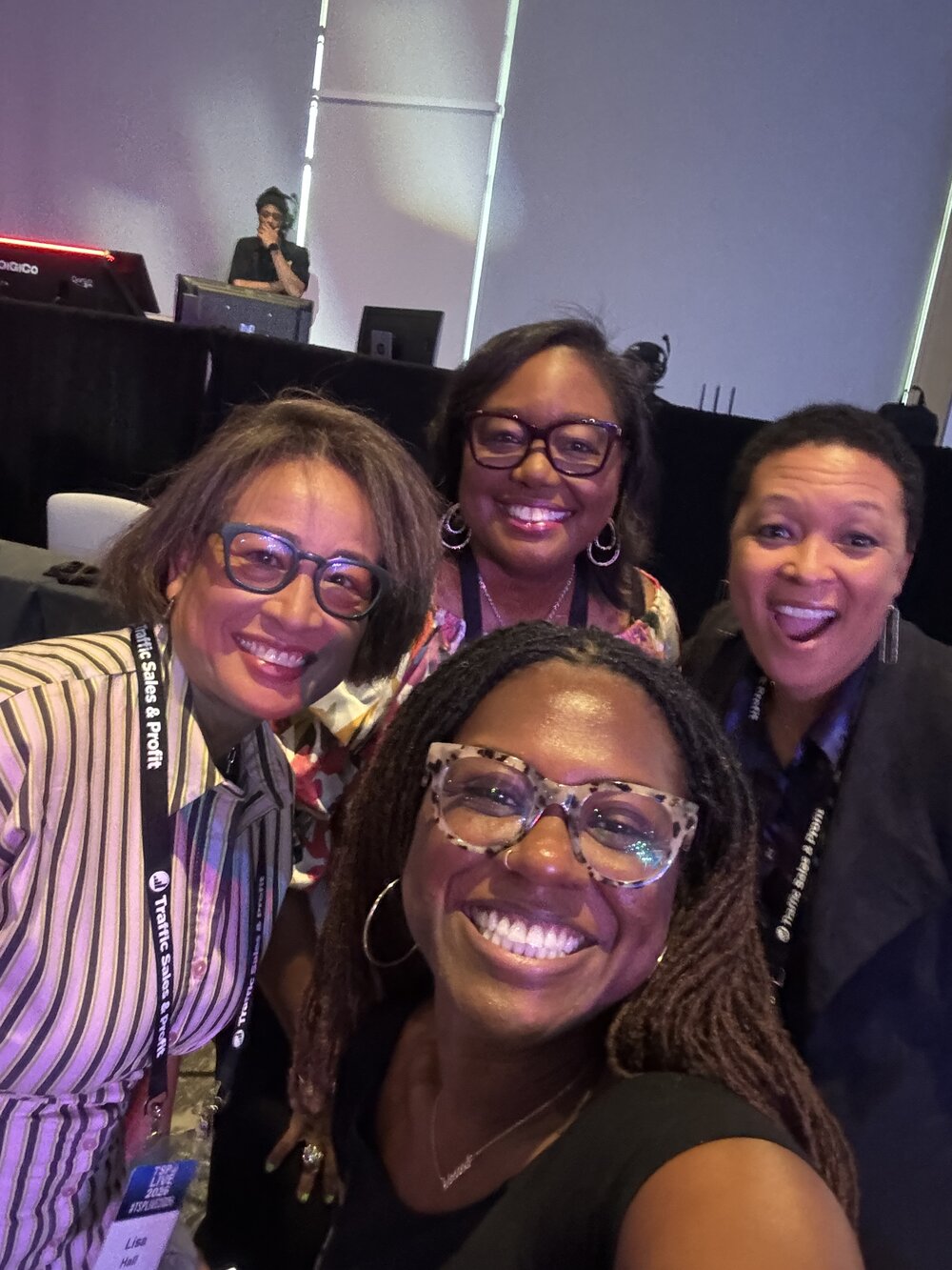 Arena members posing together at a conference