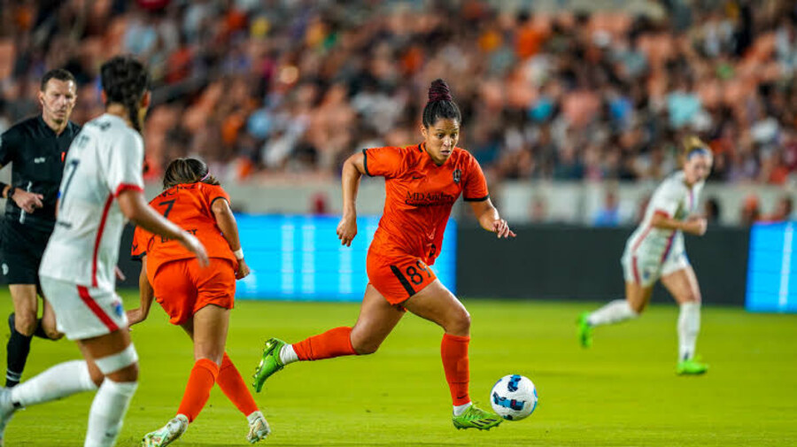 Houston Dash player in action on the pitch